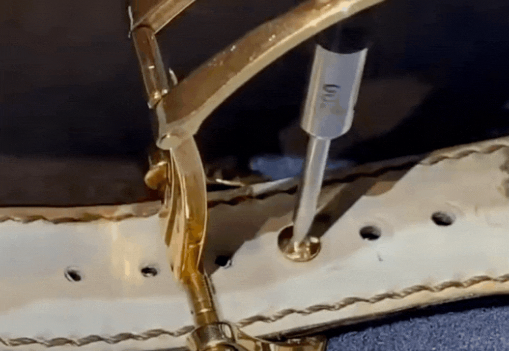 How to change the strap for your Patek Philippe Nautilus watch Remove the buckle from the leather strap hole