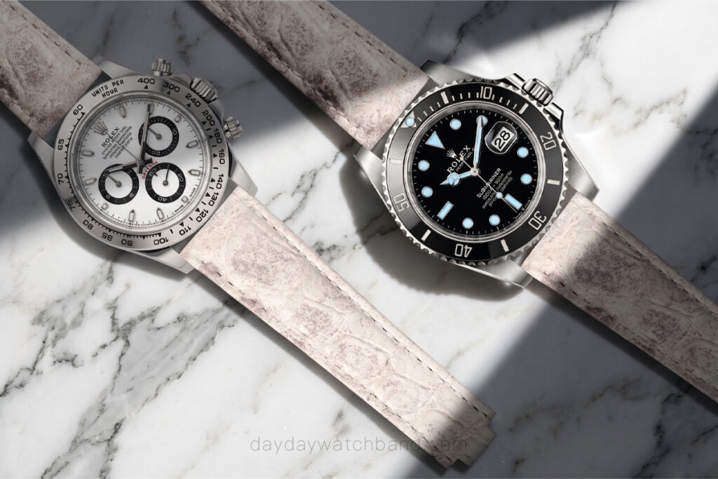 20mm crocodile watch strap for Rolex Submariner and Daytona side by side — himalayan white alligator belly-scale leather on both references.