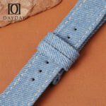 Custom denim watch strap buckle-end close-up showing keeper loops
