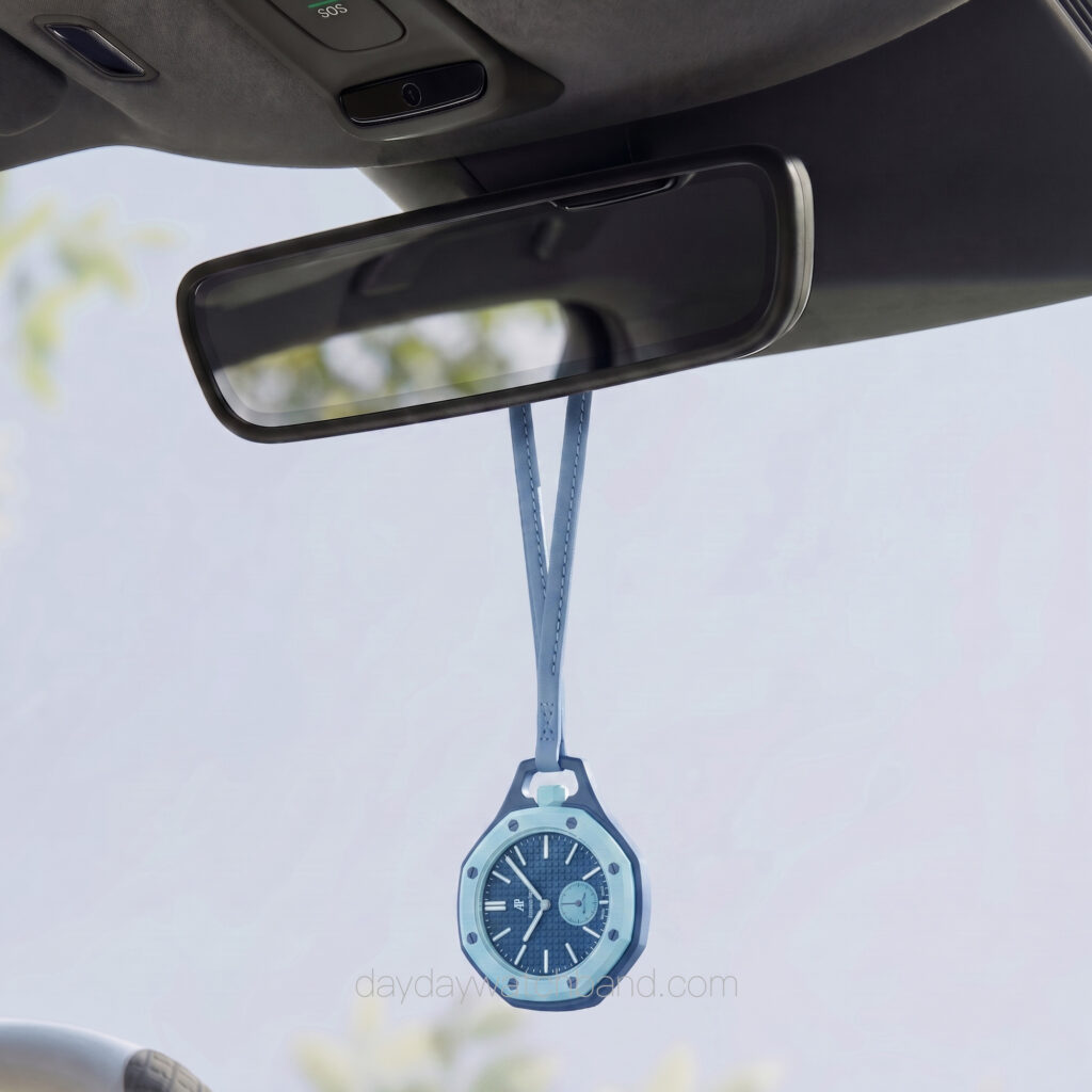 Light blue neck strap for AP Swatch Royal Pop hanging from car rearview mirror — leather lanyard for Swatch AP Royal Pop used as stylish car accessory display