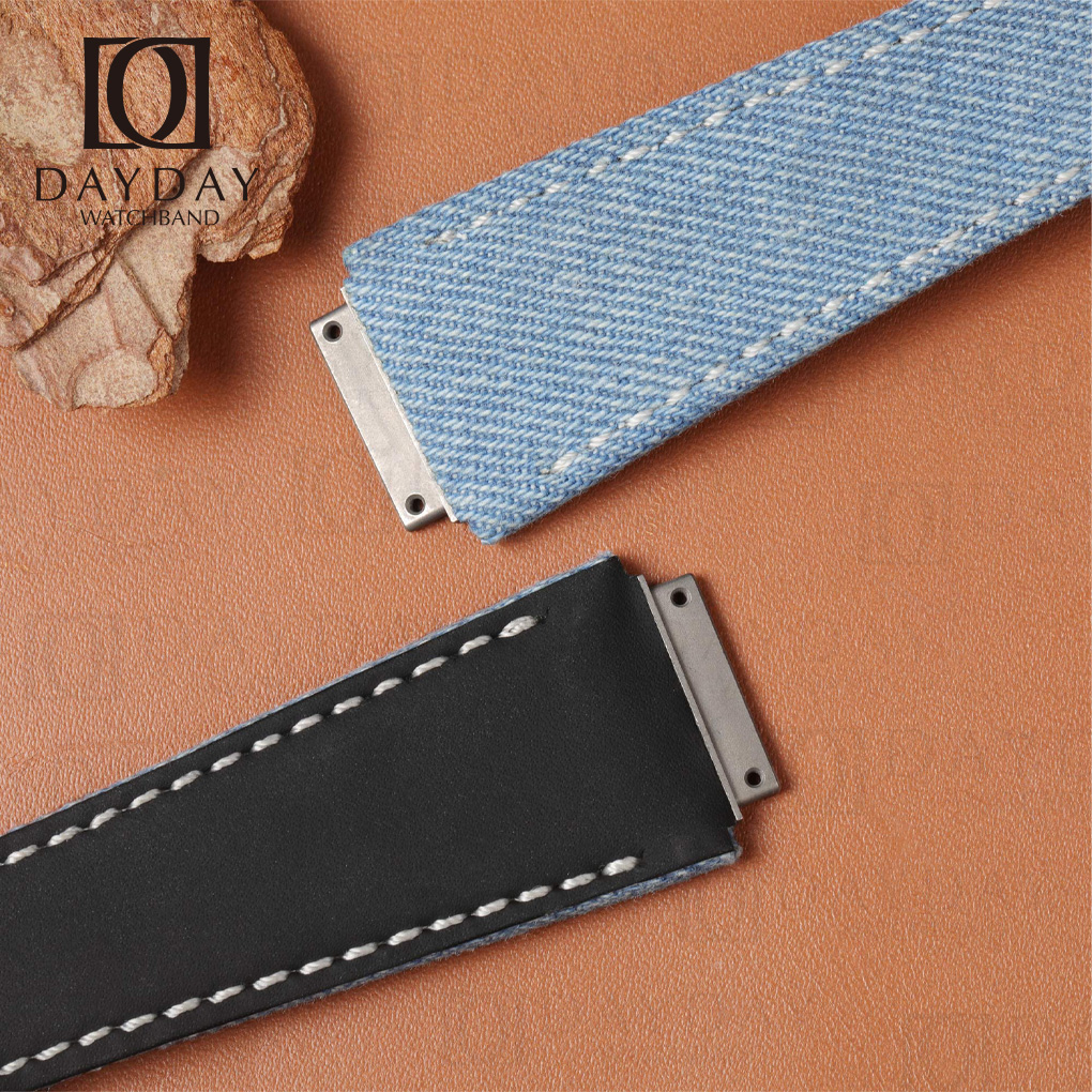 Richard Mille replacement watch strap end piece detail showing denim canvas upper strap and black leather lower strap with stainless steel end plates