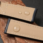Leather watch band for Patek 5524G calfskin lining showing water-resistant properties with water droplets beading on the surface