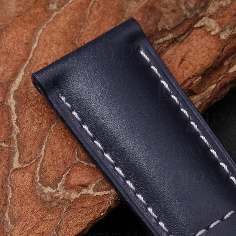 Close-up of leather watch band for Patek 5524G navy calfskin lug end showing flat cut and smooth full-grain surface