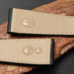 Water-resistant lining of sail canvas watch strap for Cartier, showing beige calfskin inner with water droplets