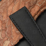 Close-up of high-density nylon weave texture on sailcloth strap for Cartier Calibre, showing structured surface pattern
