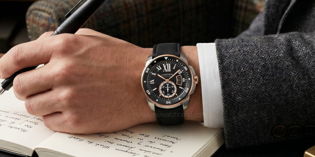 Man wearing Cartier Calibre de Cartier Diver with black sailcloth watch strap for Cartier Calibre de Cartier, rose gold and steel case on wrist