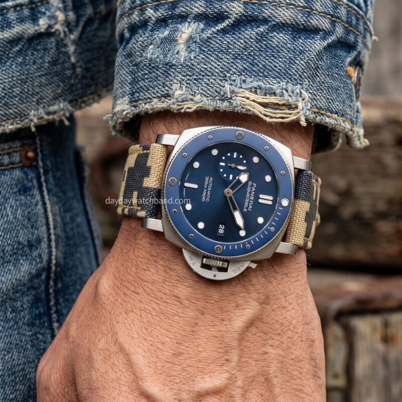 a handmade canvas strap for Panerai Submersible bronze case, camouflage pattern, seated in a vintage sports car